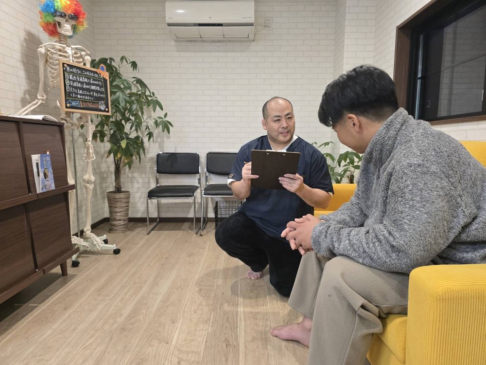 体の状態を説明する院長